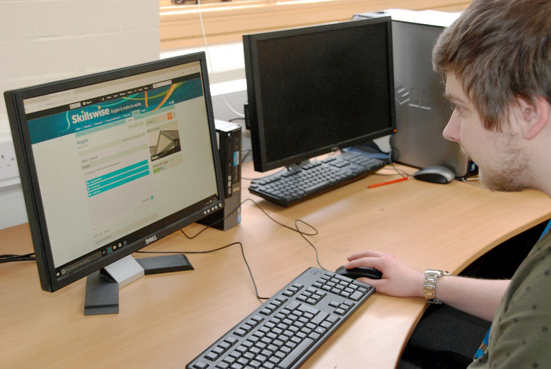 Student using computers bought with grants from The Rainford Trust and The Hemby Trust